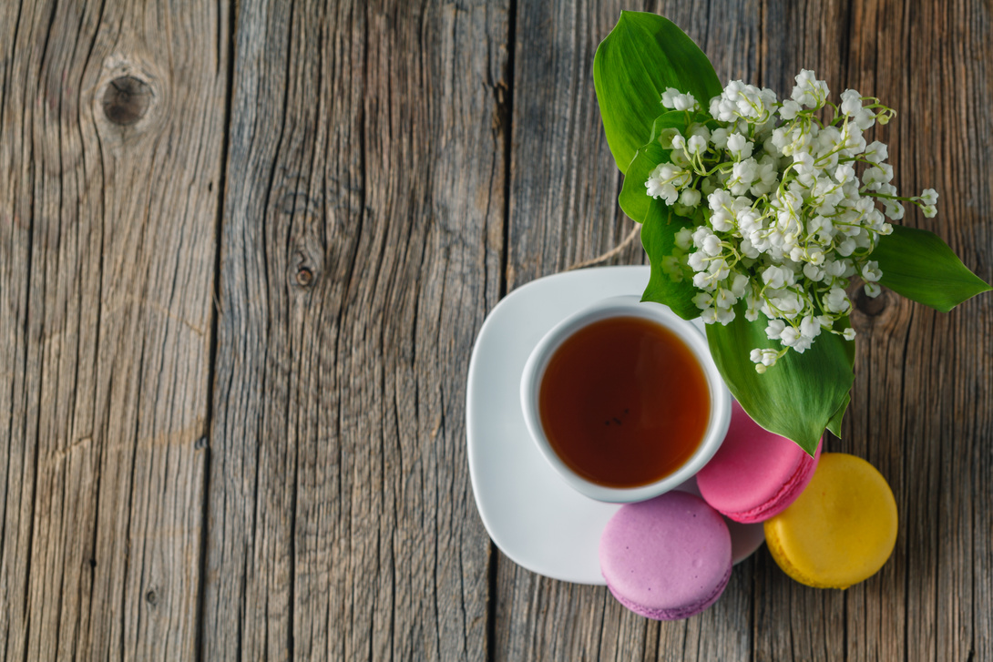 bouquet of lilies and cup of tea